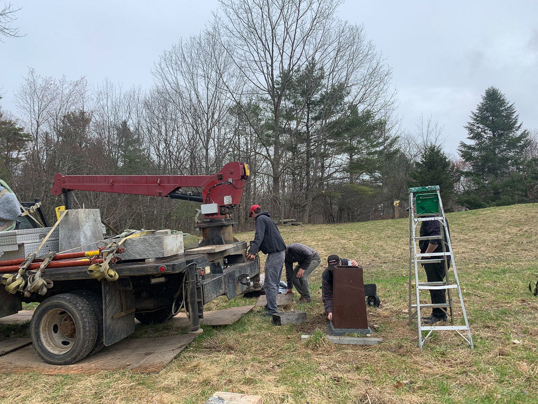 DE-INSTALLING AND INSTALLING SCULPTURE